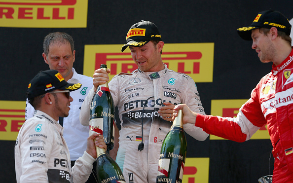 MONTMELO, SPAIN - MAY 10:  Nico Rosberg of Germany and Mercedes GP celebrates on the podium with Lewis Hamilton of Great Britain and Mercedes GP and Sebastian Vettel of Germany and Ferrari after winning the Spanish Formula One Grand Prix at Circuit de Catalunya on May 10, 2015 in Montmelo, Spain.  (Photo by Clive Mason Getty)