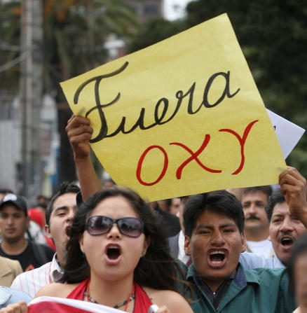 Demonstrators march in Quito, 09 May 2006, during a protest against the US oil company Oxy, accused of breaking the law and which is now seeking an agreement with the Government to avoid the expiry of its contract. AFP PHOTO/Rodrigo BUENDIA (Photo credit should read RODRIGO BUENDIA/AFP/Getty Images)