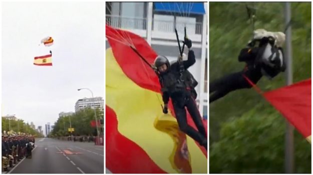 Paracaidista que portaba la bandera española queda enganchado en farola pública durante el desfile del 12 de Octubre