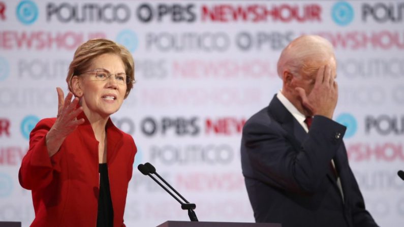 Sen. Elizabeth Warren (D-MA) speaks as former Vice President Joe Biden listens during the Democratic presidential primary debate at Loyola Marymount University on December 19, 2019 in Los Angeles, California (Justin Sullivan/Getty Images)