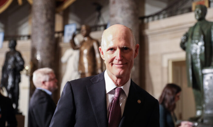 Sen. Rick Scott (R-Fla.) walks through Statuary Hall to the House Chamber for President Donald Trump’s State of the Union address in the Capitol in Washington on Feb. 4, 2020. (Charlotte Cuthbertson/The Epoch Times)