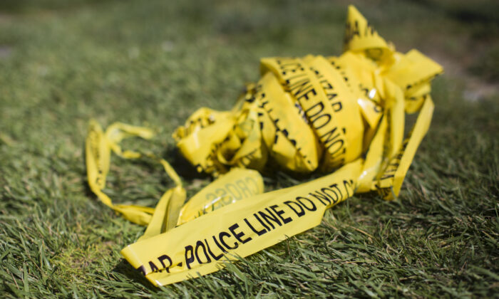 Un paquete de cinta de la escena del crimen policial en una foto de archivo. (Apu Gomes / AFP a través de Getty Images)
