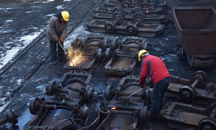 Trabajadores de la mina de carbón Datai en Mentougou, al oeste de Beijing, el 18 de diciembre de 2019. (Greg BakerAFP vía Getty Images)