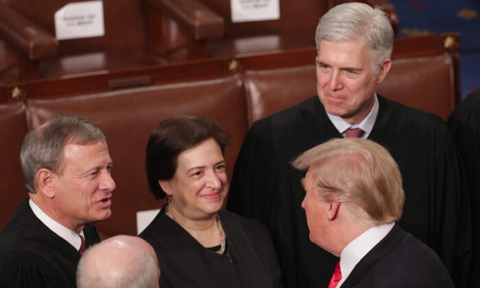 WASHINGTON, DC - FEBRUARY 05:  President Donald Trump greets Supreme Court Justices John Roberts, Elena Kagan, and Neil Gorsuch after the State of the Union address in the chamber of the U.S. House of Representatives at the U.S. Capitol Building on February 5, 2019 in Washington, DC. President Trump's second State of the Union address was postponed one week due to the partial government shutdown.  (Photo by Alex Wong/Getty Images)