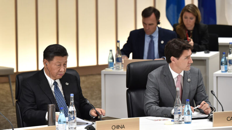 El líder de China, Xi Jinping (izq.), y el primer ministro de Canadá, Justin Trudeau (der.) en la Cumbre del G20, el 29 de junio de 2019 en Osaka, Japón. (Kazuhiro NOGI - Pool/Getty Images)
