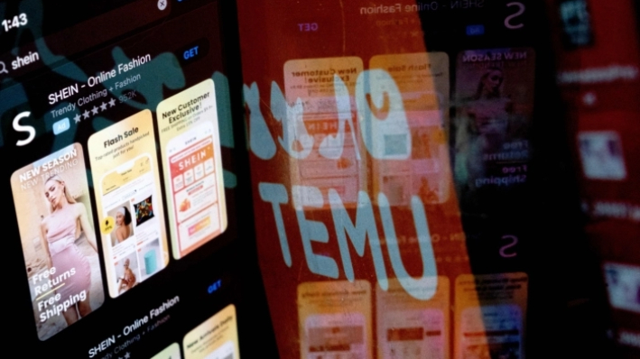 La aplicación Shein en la App Store reflejada en el logo de Temu, en Washington, el 23 de febrero de 2023. (Stefani Reynolds/AFP vía Getty Images)
