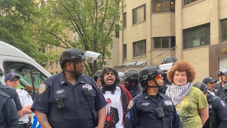 Police arrest protesters near the Met Gala in New York on May 6, 2024. (Enrico Trigoso/The Epoch Times)
