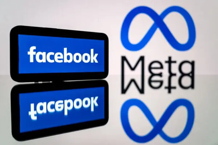 Un smartphone y una pantalla de ordenador muestran los logotipos de la red social Facebook y de su empresa matriz, Meta, en Toulouse, suroeste de Francia, el 12 de enero de 2023. (Lionel Bonaventure/AFP vía Getty Images)