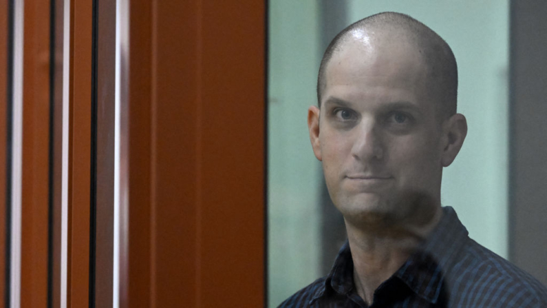 US journalist Evan Gershkovich, accused of espionage, looks out from inside a glass defendants' cage prior to a hearing in Yekaterinburg's Sverdlovsk Regional Court on June 26, 2024. (Photo by NATALIA KOLESNIKOVA / AFP) (Photo by NATALIA KOLESNIKOVA/AFP via Getty Images)