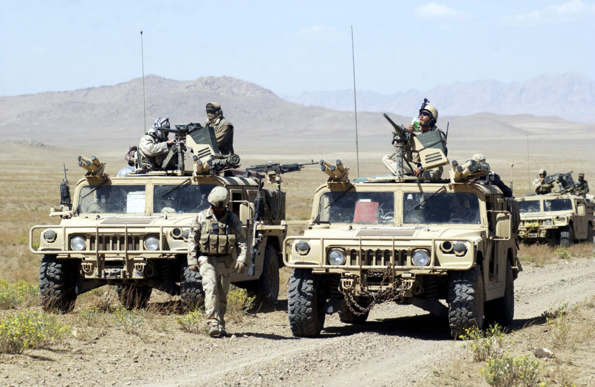 U.S. Special Forces soldiers with Task Force 31 stop their convoy on the way to conduct joint village searches with the Afghan National Army March 29, 2004 in southeast Afghanistan. U.S. Special Forces and the Afghan National Army, trained by special forces and U.S. Marines, are together stepping up the hunt for Taliban and al Qaeda forces. The deployment of the ANA to the southeast marks the first time the army has been seen by locals in this region. (Darren McCollester/Getty Images)