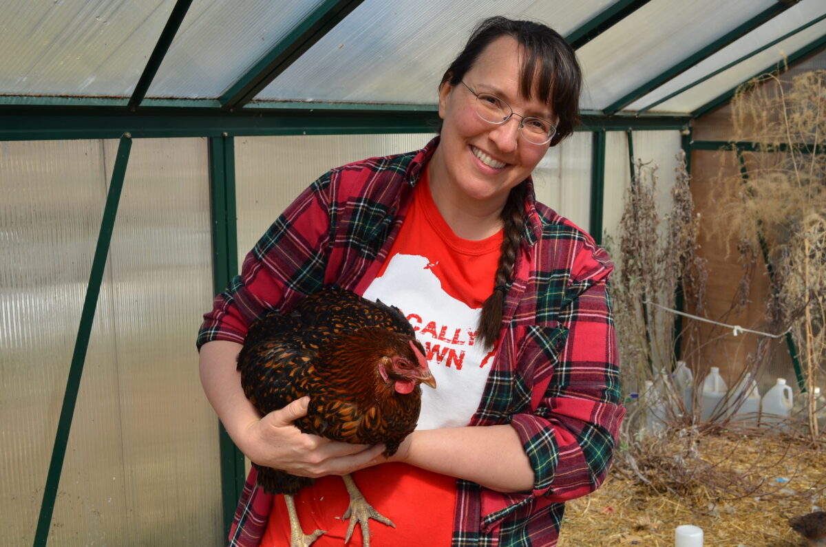 Laurie Neverman of Common-Sense Home with Miss Mimi, a Golden Laced Wyandotte. 