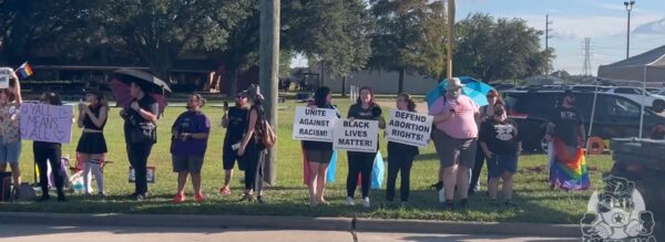 Screenshot from video recorded on September 24, 2022 by undercover, independent journalist Tayler Hansen showing liberal supporters of the new Transparent Closet, some of whom were armed with handguns, AR-15s and AK47s, at the First Christian Church of Katy, Texas. 