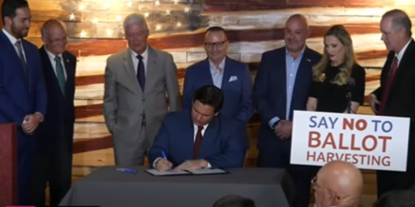 At an April 25, 2022 press conference in Spring Hill, Florida, Florida Governor Ron DeSantis signs bill into law that establishes the nation