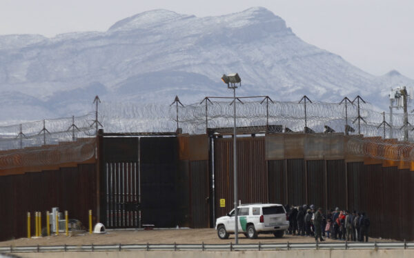 Border Patrol agents detain a group