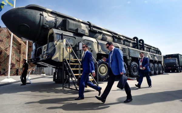 Military specialists walk past a Russian Topol intercontinental ballistic missile (ICBM) at the exposition field in Kubinka Patriot Park outside Moscow on August 22, 2017 during the first day of the International Military-Technical Forum Army-2017. (Alexander Nemenov/AFP/Getty Images)