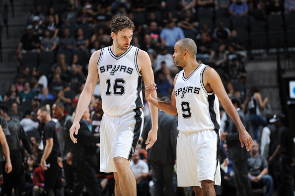 SAN ANTONIO, TX - OCTOBER 14: Pau Gasol #16 and Tony Parker #9 of the San Antonio Spurs talk during a preseason game against the Miami Heat on October 14, 2016 at the AT&T Center in San Antonio, Texas. NOTE TO USER: User expressly acknowledges and agrees that, by downloading and or using this photograph, user is consenting to the terms and conditions of the Getty Images License Agreement. Mandatory Copyright Notice: Copyright 2016 NBAE (Photos by Mark Sobhani/NBAE via Getty Images)