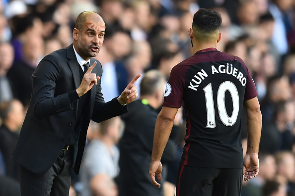 Manchester City's Spanish manager Pep Guardiola (L) gestures to Manchester City's Argentinian striker Sergio Aguero during the English Premier League football match between Tottenham Hotspur and Manchester City at White Hart Lane in London, on October 2, 2016. / AFP / Glyn KIRK / RESTRICTED TO EDITORIAL USE. No use with unauthorized audio, video, data, fixture lists, club/league logos or 'live' services. Online in-match use limited to 75 images, no video emulation. No use in betting, games or single club/league/player publications. / (Photo credit should read GLYN KIRK/AFP/Getty Images)