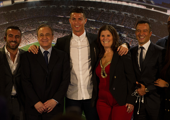 MADRID, SPAIN - NOVEMBER 07: Cristiano Ronaldo of Real Madrid is joined by his mother Maria Dolores dos Santos Aveiro and club President Florentino Perez (L), and his agent Jorge Mendez (R) following his press conference after signing a new five-year contract with the Spanish club at the Santiago Bernabeu stadium on November 7, 2016 in Madrid, Spain. (Photo by Denis Doyle/Getty Images)