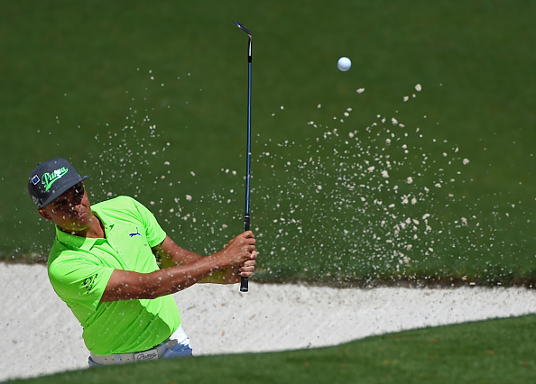 Rickie Fowler hits his ball from a bunker along the 10th green during the first round of the Masters Golf Tournament on Thursday, April 7, 2016, at Augusta National Golf Club in Augusta, Ga. (Jeff Siner/Charlotte Observer/TNS via Getty Images)