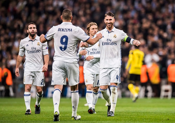 MADRID, SPAIN - DECEMBER 07: Karim Benzema of Real Madrid celebrates with teammates during the 2016-17 UEFA Champions League match between Real Madrid and Borussia Dortmund at the Santiago Bernabeu Stadium on 07 December 2016 in Madrid, Spain. (Photo by Power Sport Images/Getty Images)