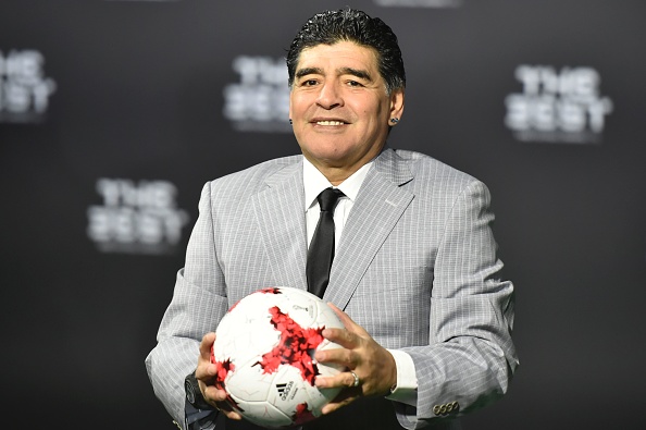 Former Argentine football player Diego Maradona poses with a ball as he arrives for The Best FIFA Football Awards 2016 ceremony, on January 9, 2017 in Zurich. / AFP / MICHAEL BUHOLZER (Photo credit should read MICHAEL BUHOLZER/AFP/Getty Images)