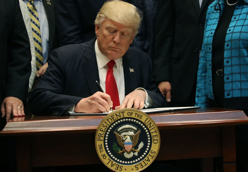 WASHINGTON, DC - APRIL 26: U.S. President Donald Trump signs the Education Federalism Executive Order that will pull the federal government out of K-12 education, in the Roosevelt Room at the White House, on April 26, 2017 in Washington, DC.